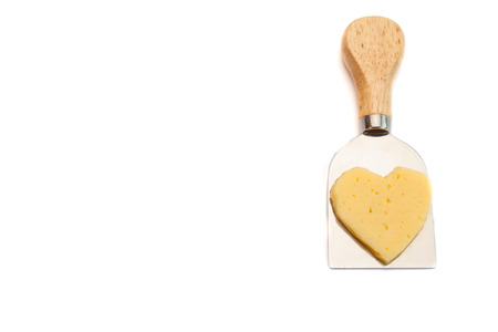 Tasty cheese and four knife for cheese isolated on whiteの写真素材