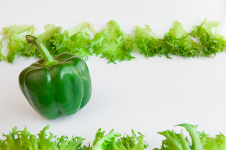 Fresh ripe vegetables - sweet  green pepper and leaves of frillis. Bell peppers.