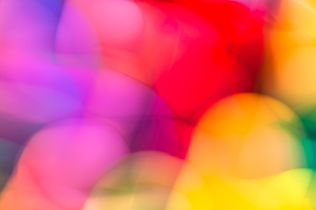 The colorful abstract background with defocused lights