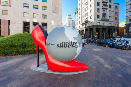 MILAN, ITALY - September 06, 2016:Installation of huge red high heel shoes with globe inside with title "Twelve shoes" of footwear exhibition MICAM in Milan, Italyのeditorial素材