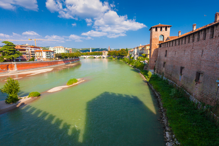 VERONA, ITALY- September 08, 2016: Scenery with Adige River and Ponte della Vittoria from Castelvecchio Bridge (Ponte di Castelvecchio) in summer day.のeditorial素材