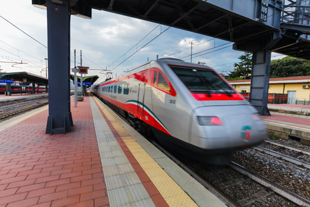 Florence, ITALY- September 10, 2016: Speed train "TrenItalia" of  Frecciargento type in  motion on the station in Florence "Firenze Campo di Marte" with speed to 250 km per hour.のeditorial素材