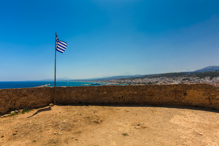 Rethymnon, Island Crete, Greece, - June 23, 2016: View on the inside part of Fortezza Castle in Rethymnon and the national flag of European country Greeceのeditorial素材