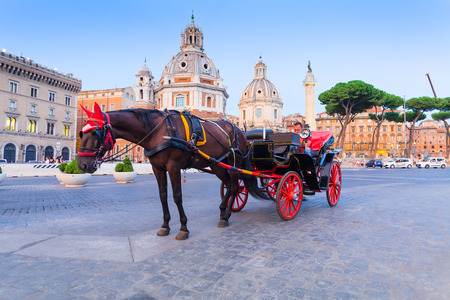 ROME, ITALY - September  12, 2016: Roman carts (Carriage) with red wheels, waiting for tourists on Piazza Foro Traiano in Romeのeditorial素材