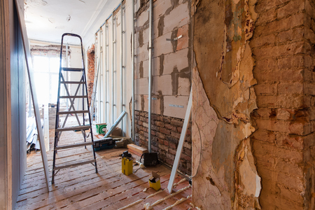 Interior of apartment with materials during on the renovation and construction ( making wall from gypsum plasterboard)の写真素材