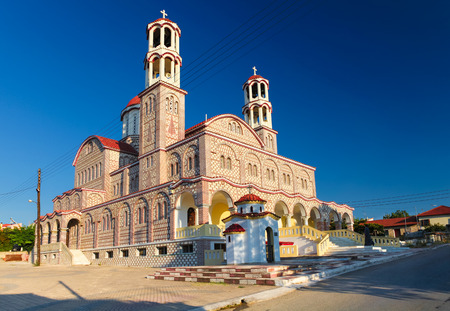 Nea Potidea, Greece- August 26, 2013: Church of Agios Georgios is a greek orthodox church in village Nea Potidaia (Nea Poteidea) in the evening in  peninsula Kassandra, Chalkidiki, Greeceのeditorial素材