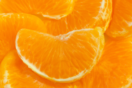 Close-up of sliced fresh and ripe tangerine.