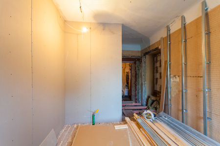 Interior of upgrade apartment with materials during on the remodeling, renovation, extension, restoration, reconstruction and construction. ( making wall from gypsum plasterboard)