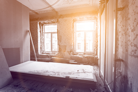 Working process of installing pvc windows and metal frames for plasterboard - drywall and construction tools in room of apartment is under construction, remodeling, renovation, extension, restoration and reconstructionの写真素材
