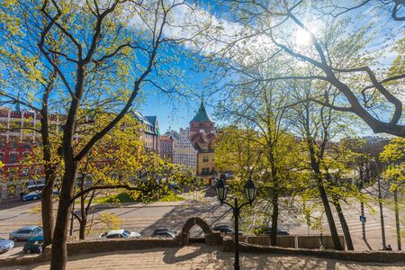 RIGA, LATVIA - MAY 06, 2017: View on  pathways with blossom trees, bushes and walking  people in The Park Bastion Hill that is located in the city center of Riga. Bastion Hill is one of the most romantic places in central Rigaのeditorial素材