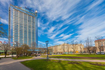 RIGA, LATVIA - MAY 06, 2017: View on the bulding of Radisson Blu Latvija Conference and Spa Hotel and part of centrally-located park Esplanade that is located in the city center of Riga.のeditorial素材