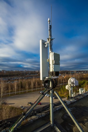 Panel antenna of GSM DCS UMTS LTE bands and radio unit are as part of communication equipment of...