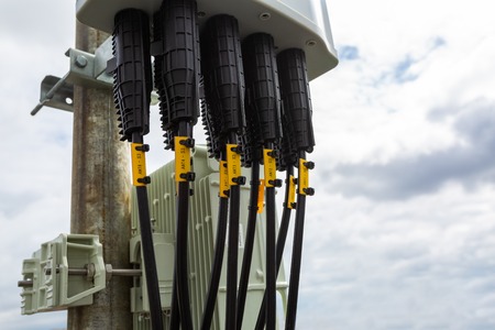 Panel antenna of GSM DCS UMTS LTE bands and outdoor remote radio unit are as part of communication...