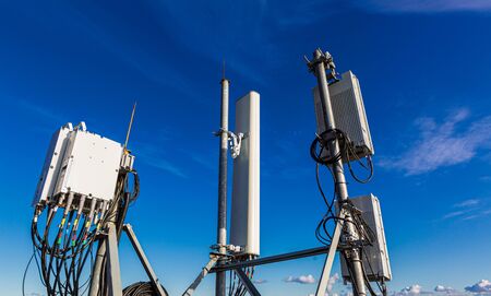 Telecommunication masts with microwave, radio panel antennas, outdoor remote radio units, power...