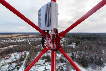 Red telecommunication tower or mast and remote electric tilt and remote radio unit with power and...