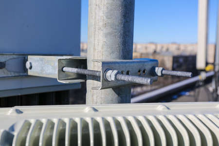 Russia, Saint-Petersburg - April 30, 2018: Mounting of Outdoor remote radio unit (RRU) and cables of Base Transceiver Station (BTS) are installed on top of a building. Outside part 5G, 4G, 3G, 2G basic stationのeditorial素材