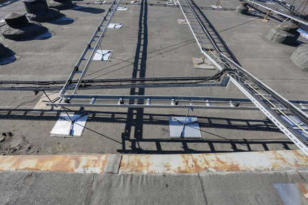 Russia, Saint-Petersburg - April 30, 2018: Metal ladder trays with power, data, optic and ground cables of Base Transceiver Station (BTS) are installed on top of a building. Outside part 5G, 4G, 3G, 2G basic stationのeditorial素材