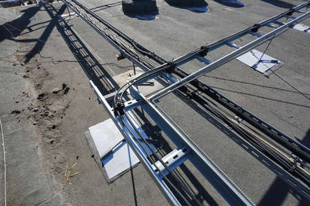 Russia, Saint-Petersburg - April 30, 2018: Metal ladder trays with power, data, optic and ground cables of Base Transceiver Station (BTS) are installed on top of a building. Outside part 5G, 4G, 3G, 2G basic stationのeditorial素材