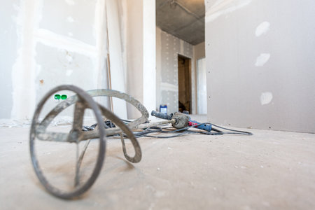 Construction tool -manual concrete mixer is on the floor in apartment is under construction, remodeling, renovation, extension, restoration and reconstruction.の写真素材