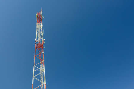 Telecommunication tower or mast with microwave, radio panel antennas, outdoor remote radio units,...