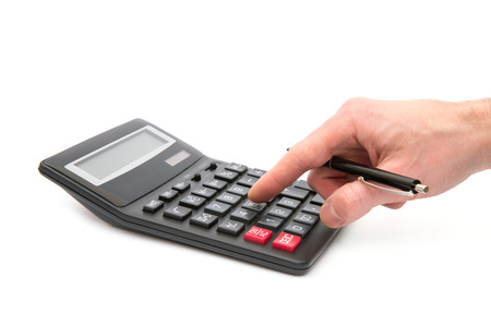 Calculator with hand on whiteの写真素材