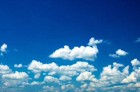 Blue sky background with tiny cloudsの写真素材