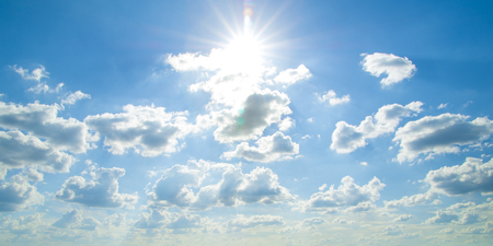 Blue sky background with a tiny cloudsの写真素材