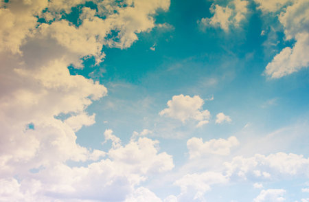Blue sky with clouds in grunge style.の写真素材
