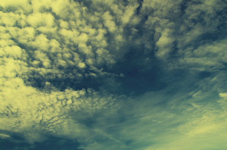 Vintage background in the blue shade with cloudsの写真素材