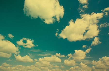 Blue sky with clouds in grunge style.の写真素材