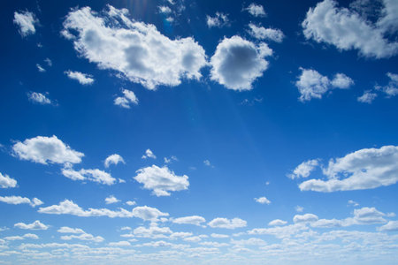 Blue sky background with tiny cloudsの写真素材