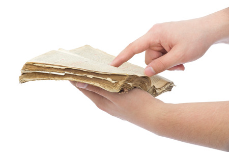 Opened book in hands isolated on white backgroundの写真素材