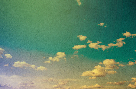 Blue sky with clouds in grunge style.の写真素材