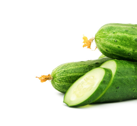 Cucumber and slices isolated over white backgroundの写真素材
