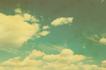 Blue sky with clouds in grunge and retro style.の写真素材