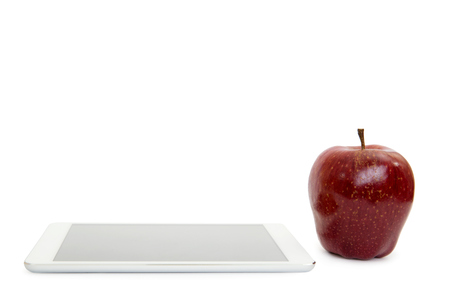  apple on digital tablet pc on white backgroundの写真素材