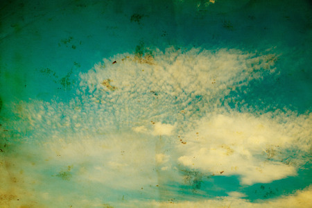 white fluffy clouds in the blue skyの写真素材