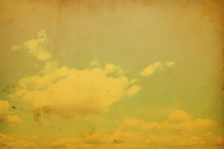 Blue sky with clouds in grunge and retro style.の写真素材