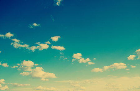 Blue sky with clouds in grunge style.の写真素材
