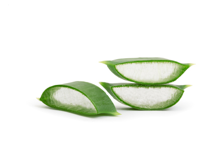 aloe vera leaf and slices isolated on white backgroundの写真素材