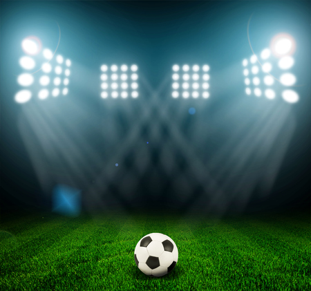 Soccer ball on the field of stadium with lightの写真素材