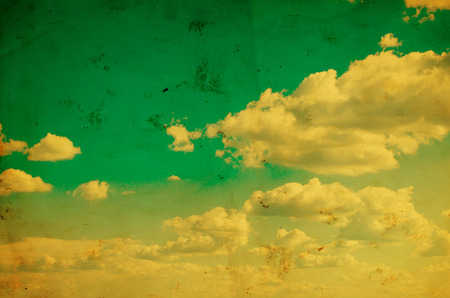 Blue sky with clouds in grunge style.の写真素材