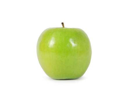 Green apple with leaf isolated on a white の写真素材