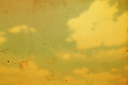 Blue sky with clouds in grunge and retro style.の写真素材