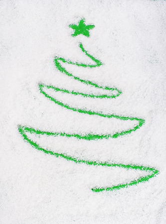Christams tree on snow(writting)の写真素材