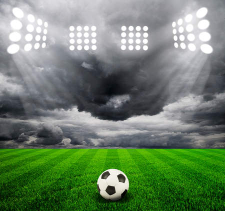 Soccer ball on the field of stadium with lightの写真素材