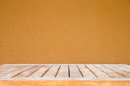 Wooden deck table on old grunge backgroundの写真素材