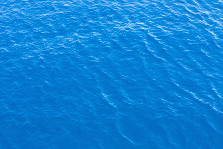 Blue sea surface with wavesの写真素材