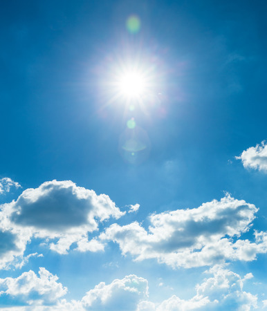 Blue sky with clouds and sunの写真素材