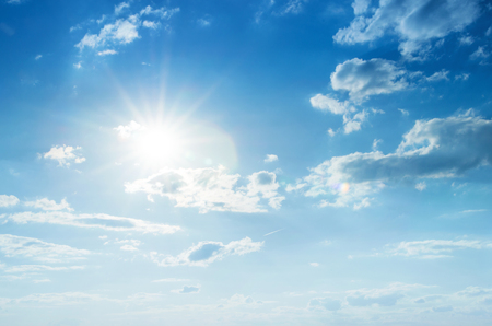 Blue sky with clouds and sun.の写真素材
